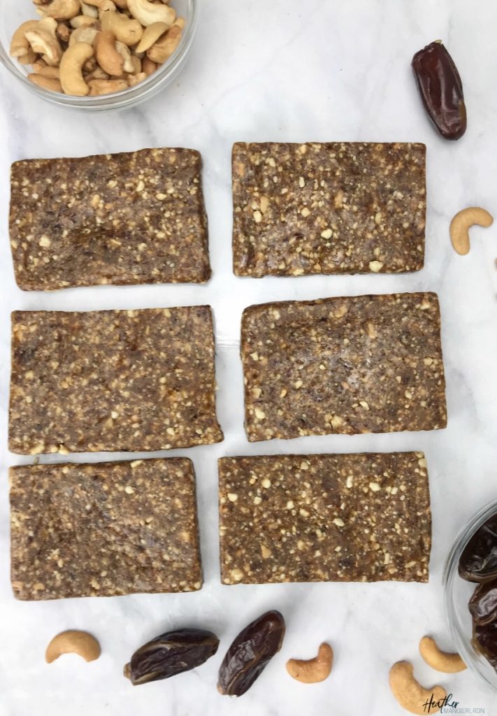 These homemade fruit and nut bars were inspired by my love for the cashew-cookie flavored LaraBar. They are the perfect snack to take with you on a hike or bike ride or to satisfy a mid-day sweet tooth