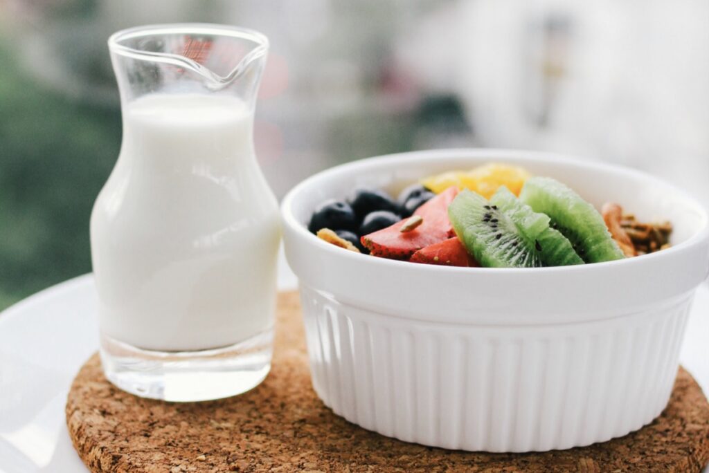 A glass of milk and some fruit is a quick breakfast idea