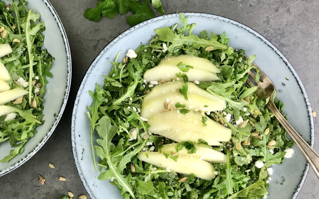 This pear and arugula salad with a reduced-fat lime cilantro vinaigrette is 300 calories, 9 grams of protein, 21 grams of fat and 6 grams of fiber. The combination of sweet, savory and salty flavors make it a delicious lunch or cut the serving size in half for a side salad to serve with dinner