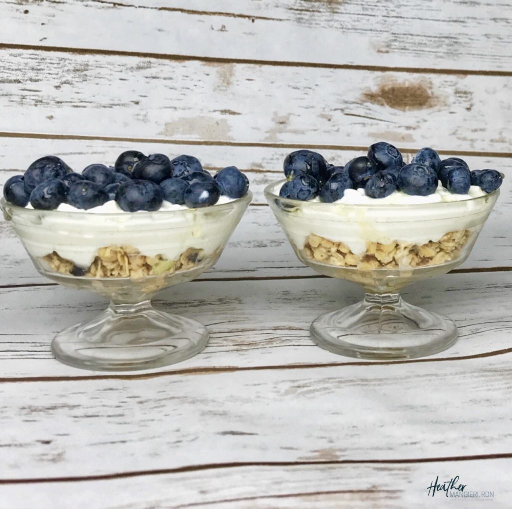 granola and cottage cheese parfait topped with blueberries