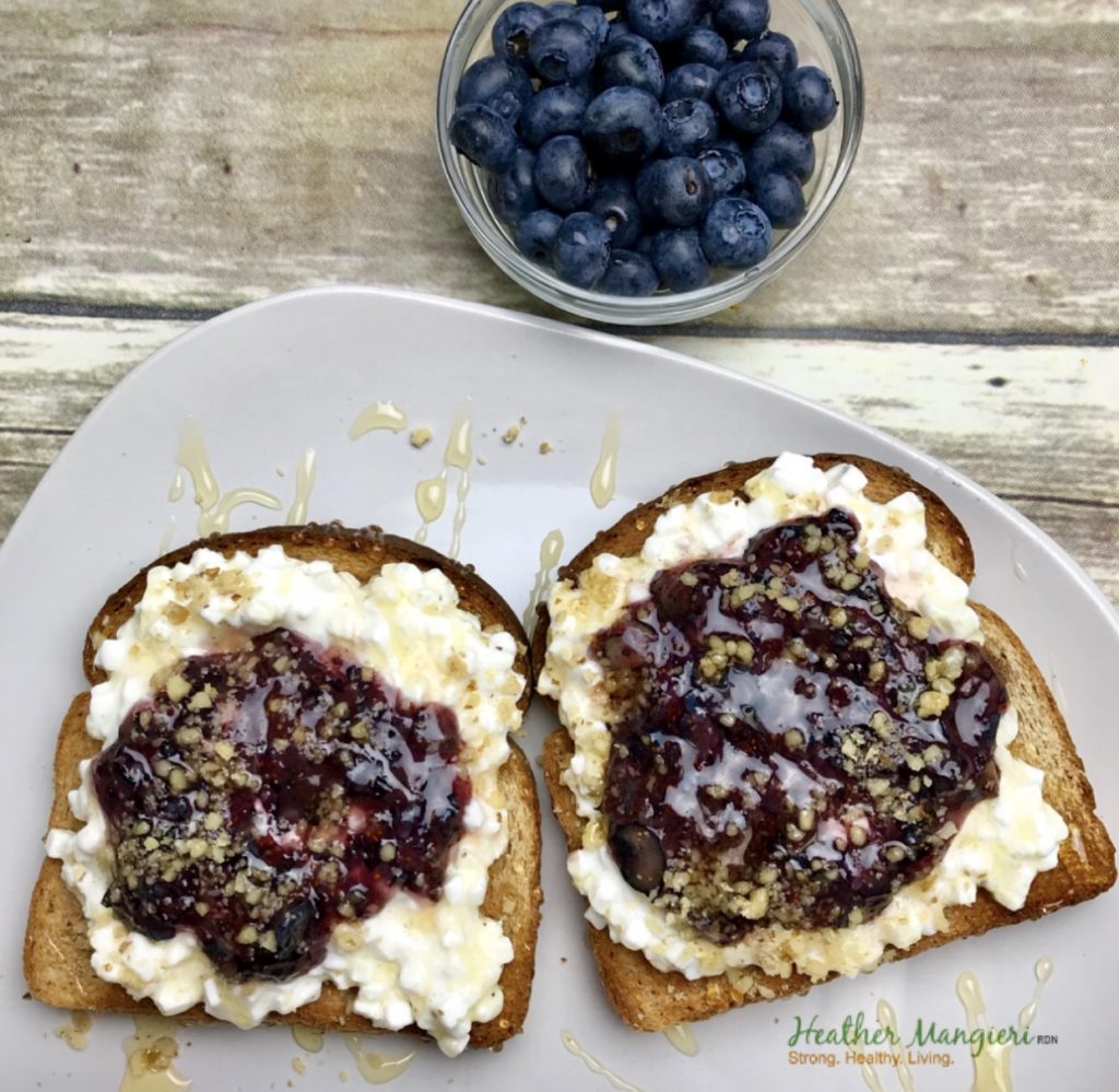 Whole grain toast topped with cottage cheese and pureed jam