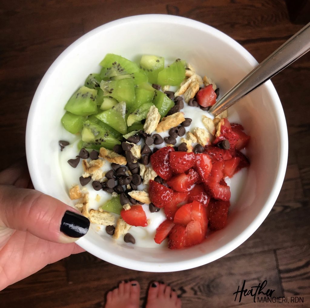  Diced Strawberries, Kiwi, Crushed Pretzel Pieces and Mini Chocolate Chips are the toppings for this bowl