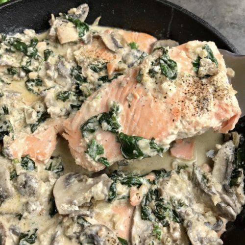 This pan-seared salmon is simmered with a reduced-fat creamy mushroom and garlic sauce that is bursting with flavor and omega-3 fatty acids. This easy recipe incorporates baby spinach into the sauce, so you have a one-pot, healthy seafood meal to serve for dinner.