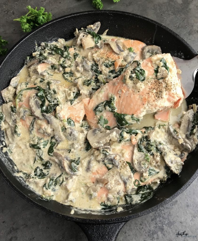 This pan-seared salmon is simmered with a reduced-fat creamy mushroom and garlic sauce that is bursting with flavor and omega-3 fatty acids. This easy recipe incorporates baby spinach into the sauce, so you have a one-pot, healthy seafood meal to serve for dinner.