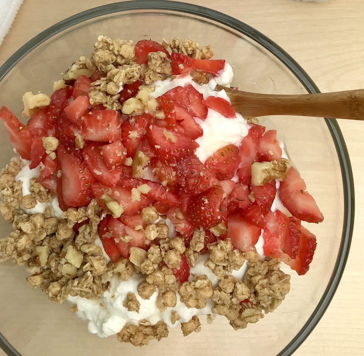 Snacks for Athletes Greek Yogurt Topped with Granola and Strawberries