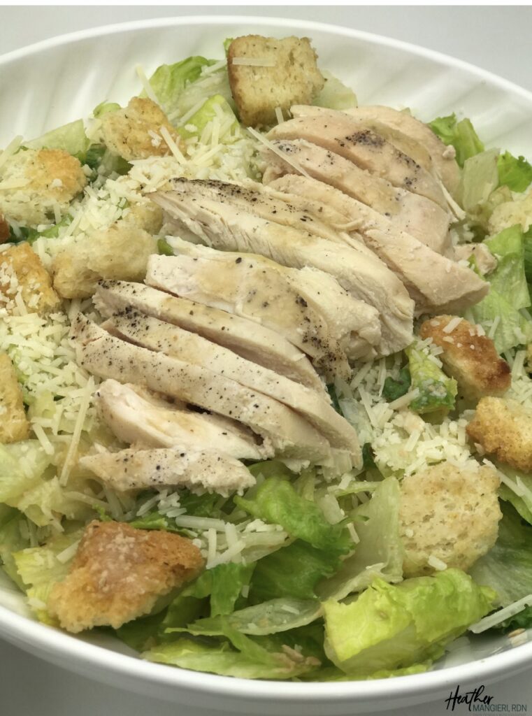 Learn how many calories and fat are in a Caesar salad and how to make a healthier version