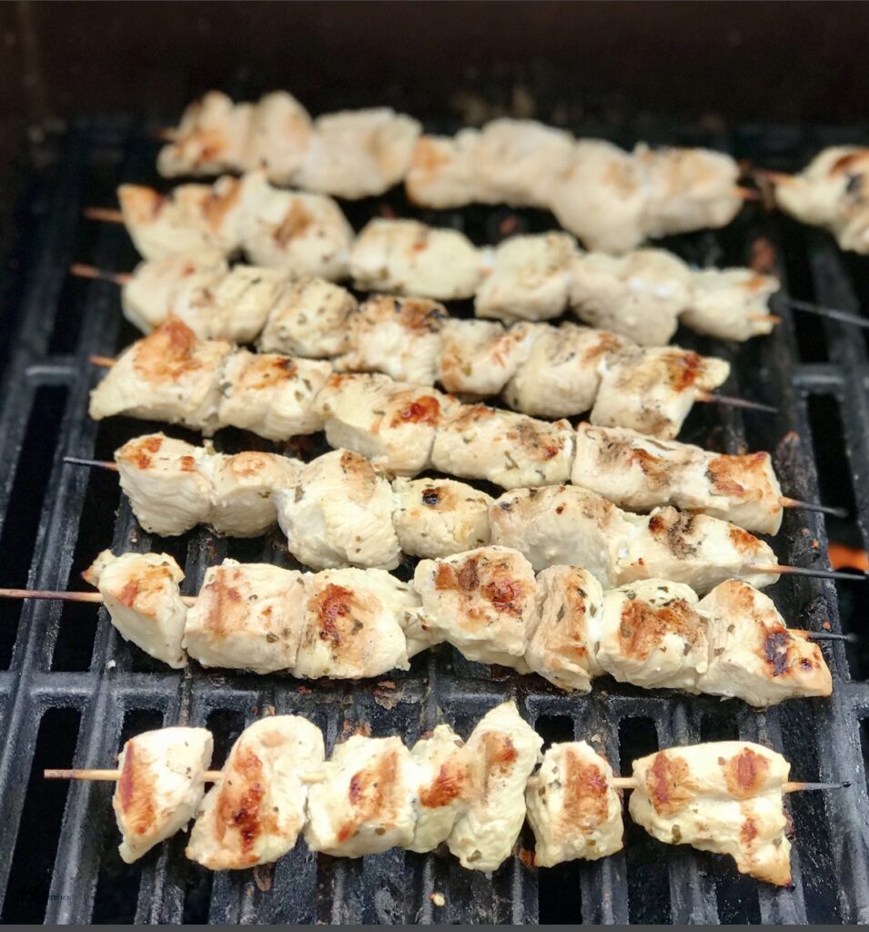 Boneless, skinless, marinated chicken skewers on the grill