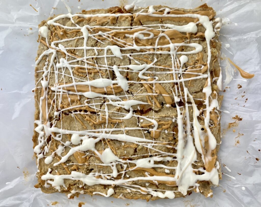 The step by step instructions to make white bean blondie bars - adding the chocolate drizzle