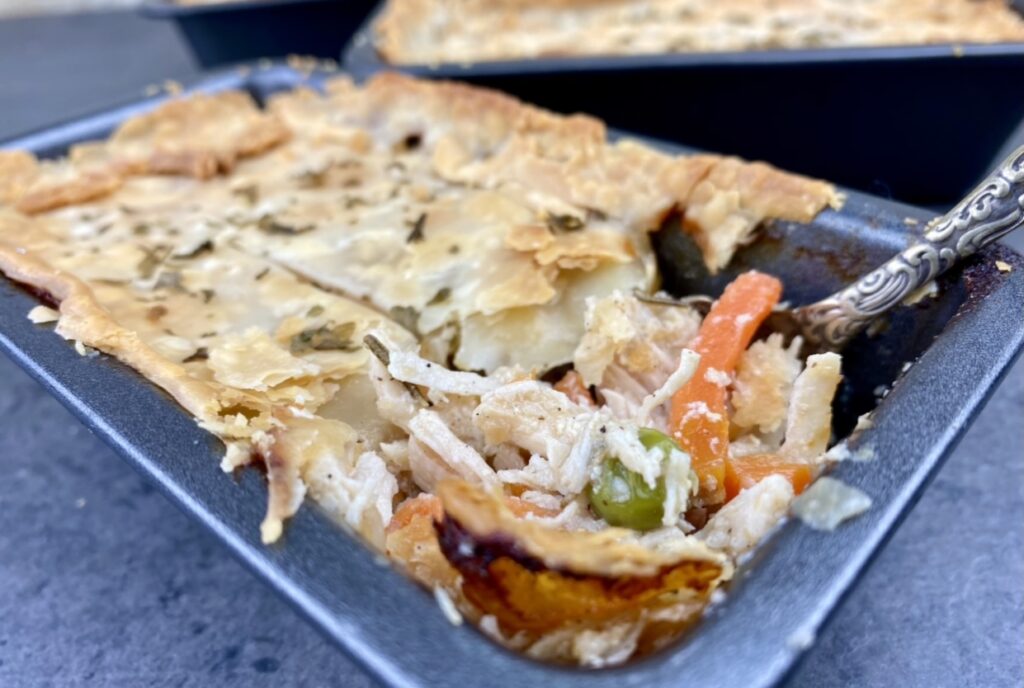 This healthier chicken pot pie recipe is modified from traditional recipes to provide fewer calories, fat and sodium while delivering the same creamy, flavorful taste you expect from this comfort food. It’s made in individual, single-serve portions so everyone is sure to get their fair share of veggies and protein!