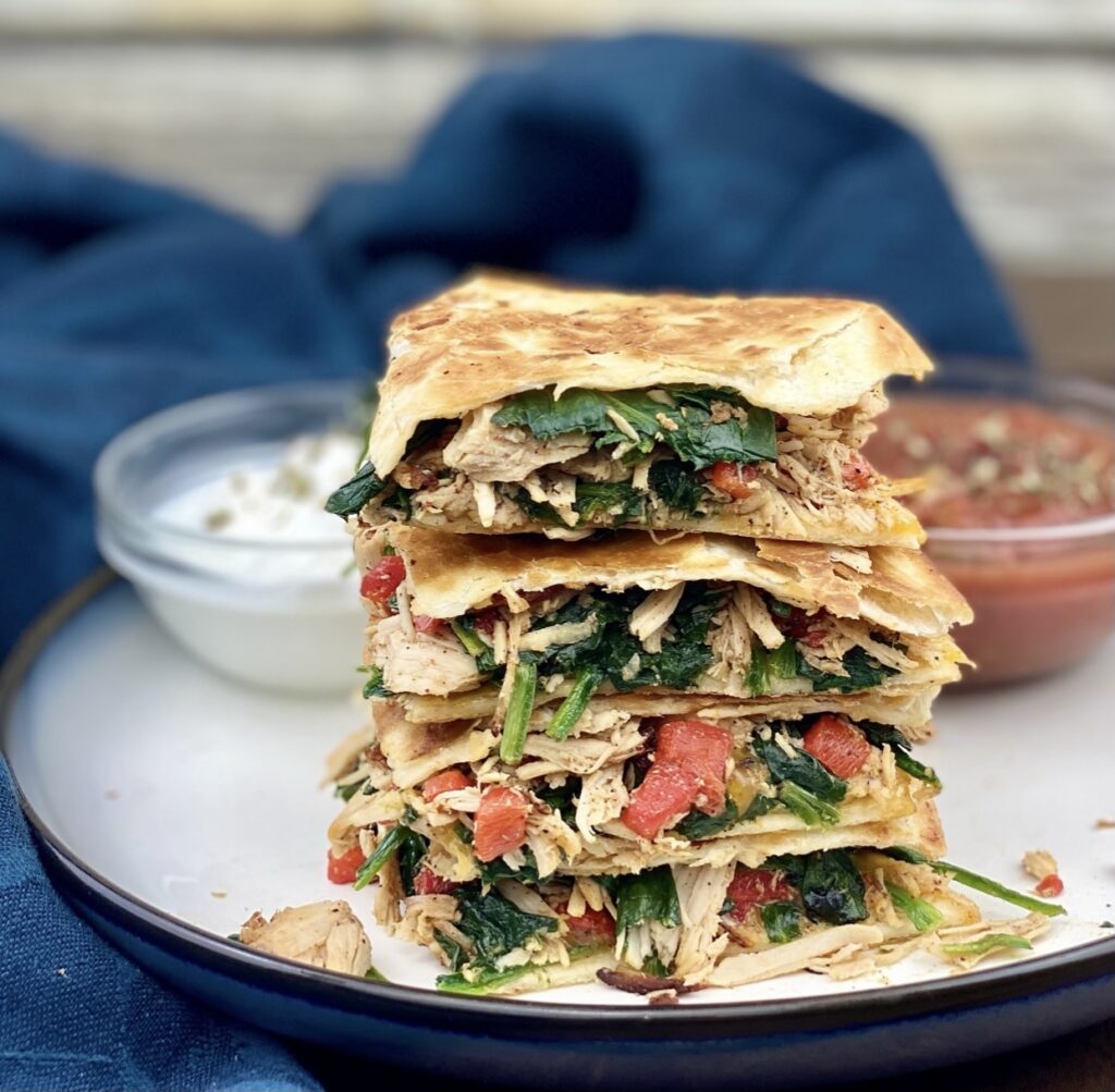 This crispy, flavor-filled chicken and spinach quesadilla is packed with nutrition and takes under 10 minutes to make! It’s a delicious and easy way to get more greens, protein, fiber, calcium and iron in your diet!
