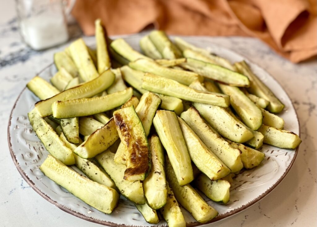 This basic oven-roasted zucchini is tender with a crispy outer coating and pairs perfectly with just about any dish. 