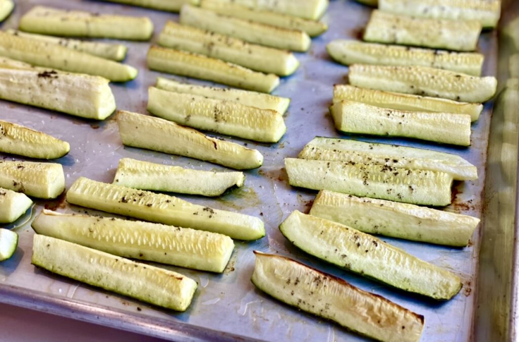 roasted zucchini on a sheet pan after cooking