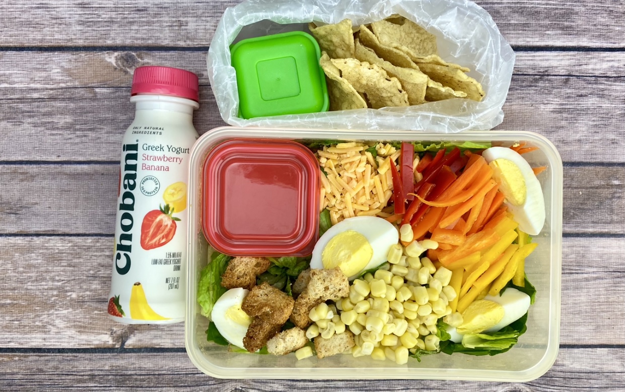 Pack a salad bar as a great school lunch option served with a yogurt beverage.