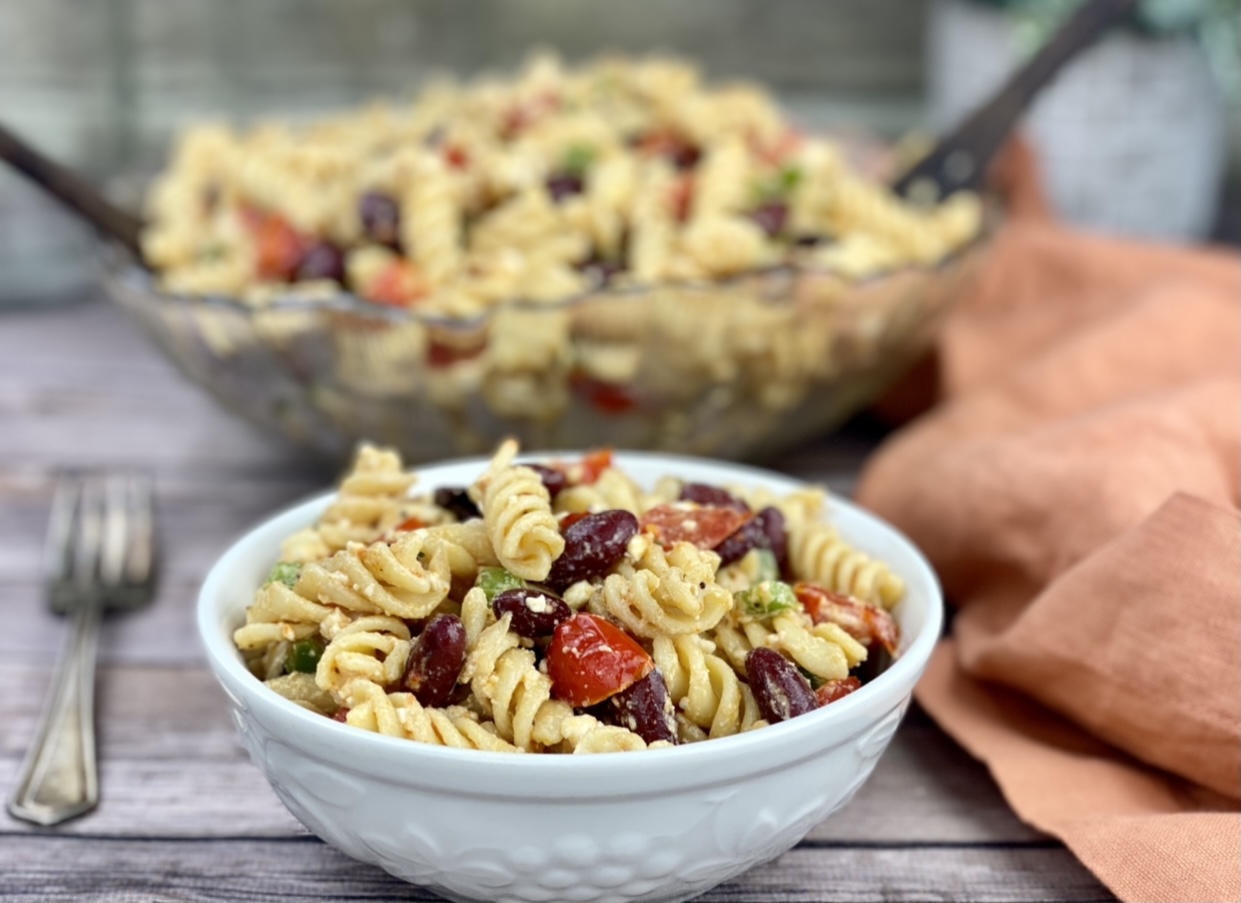 This is a photo of a large bowl of the protein-packed pasta salad recipe shared in this post. 