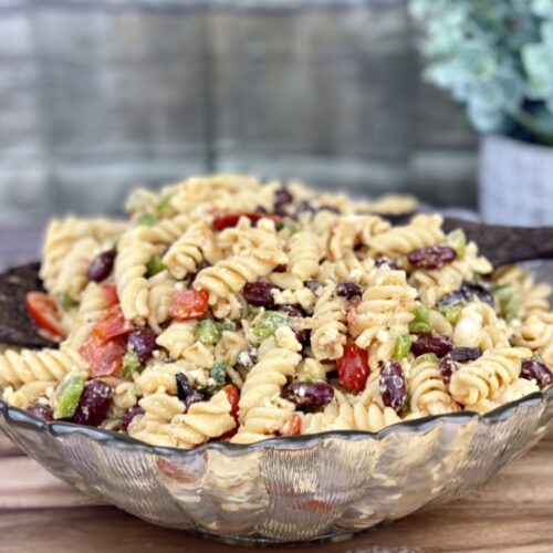 This is a photo of a large bowl of the protein-packed pasta salad recipe shared in this post.