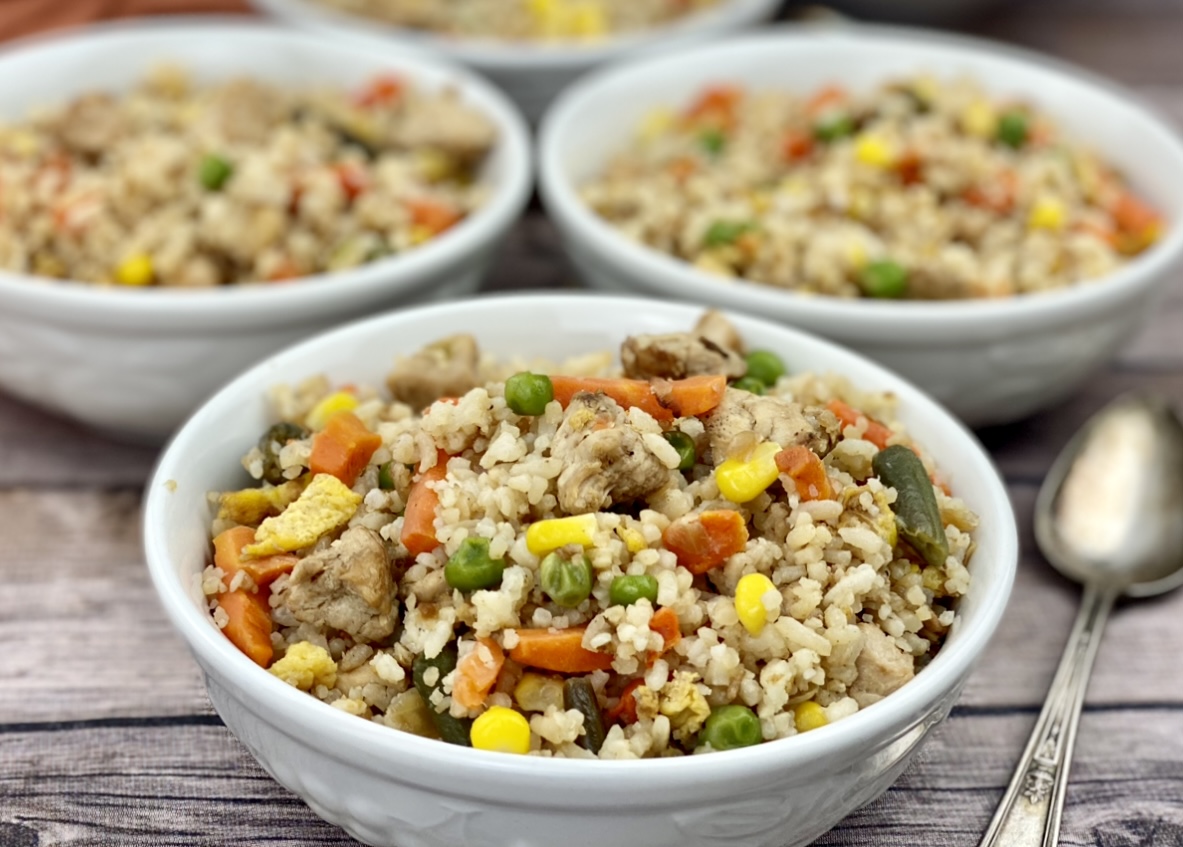 Serving bowls of healthier chicken fried rice